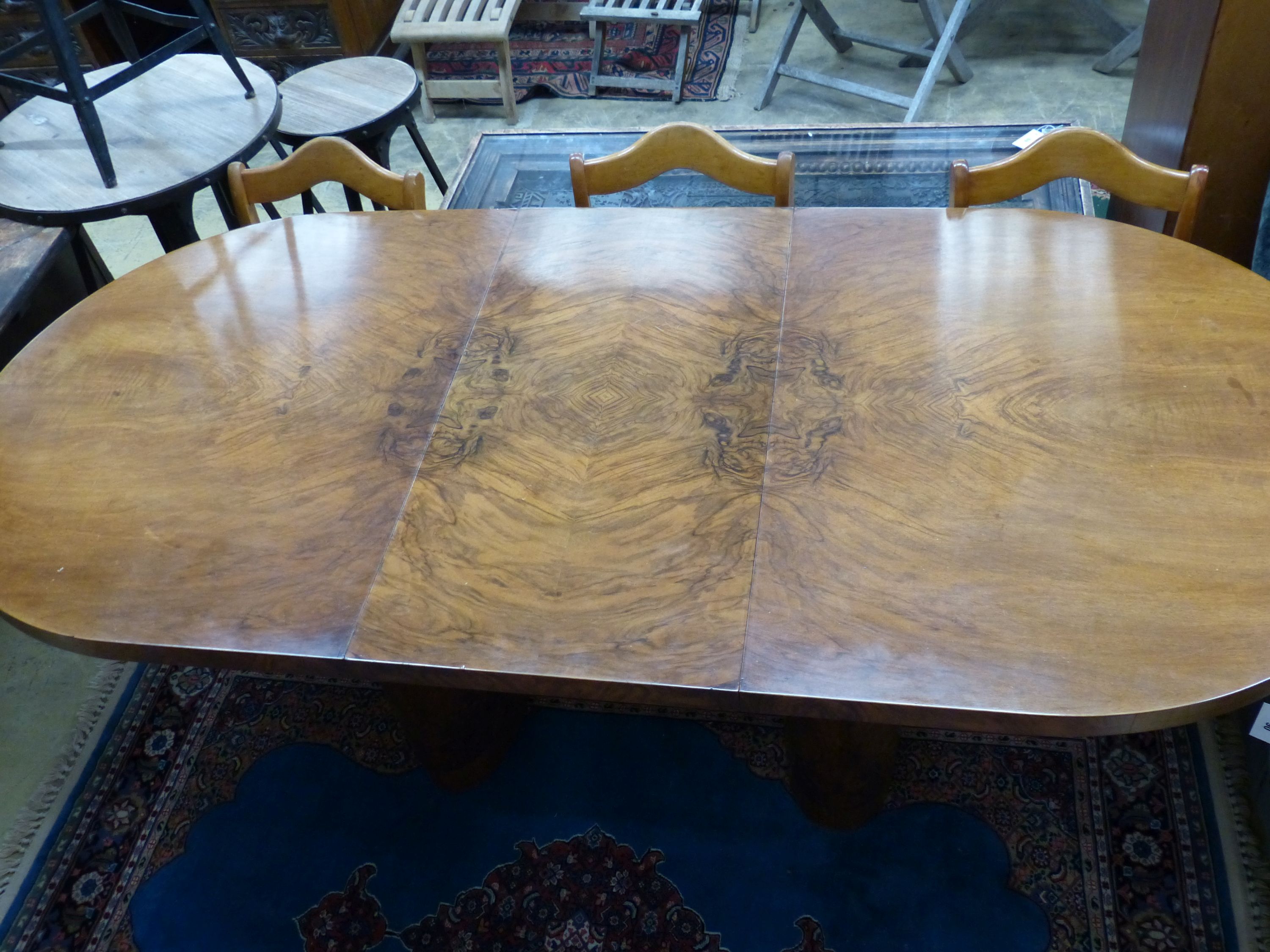 An Art Deco figured walnut extending dining table with one leaf, extends to 199cm, width 92cm